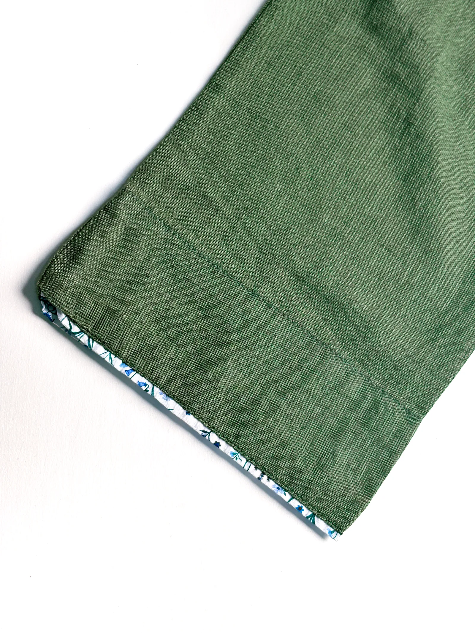 Olive Panjabi hem, seam, and floral contrast detail