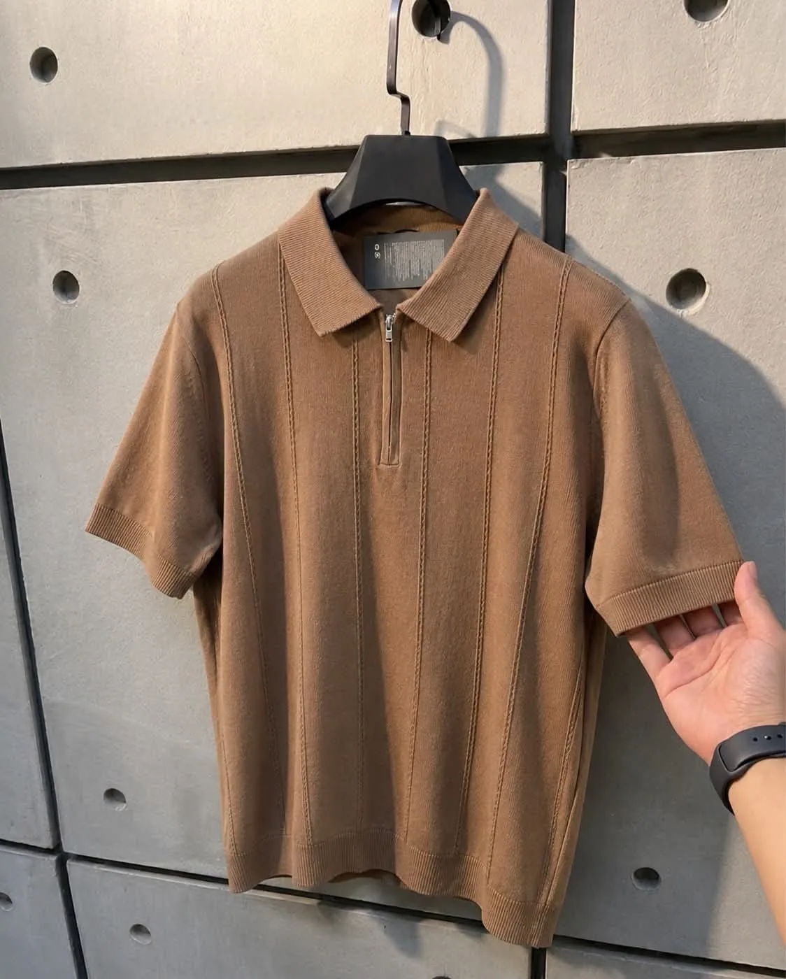 Camel textured zip polo on hanger